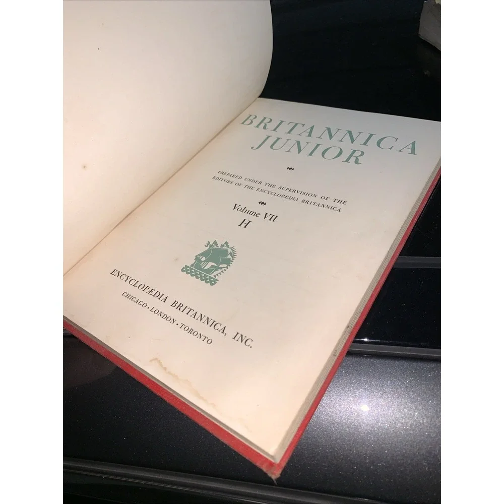 Volume 7 (H) of the vintage red and gold Britannica Junior Encyclopædia
